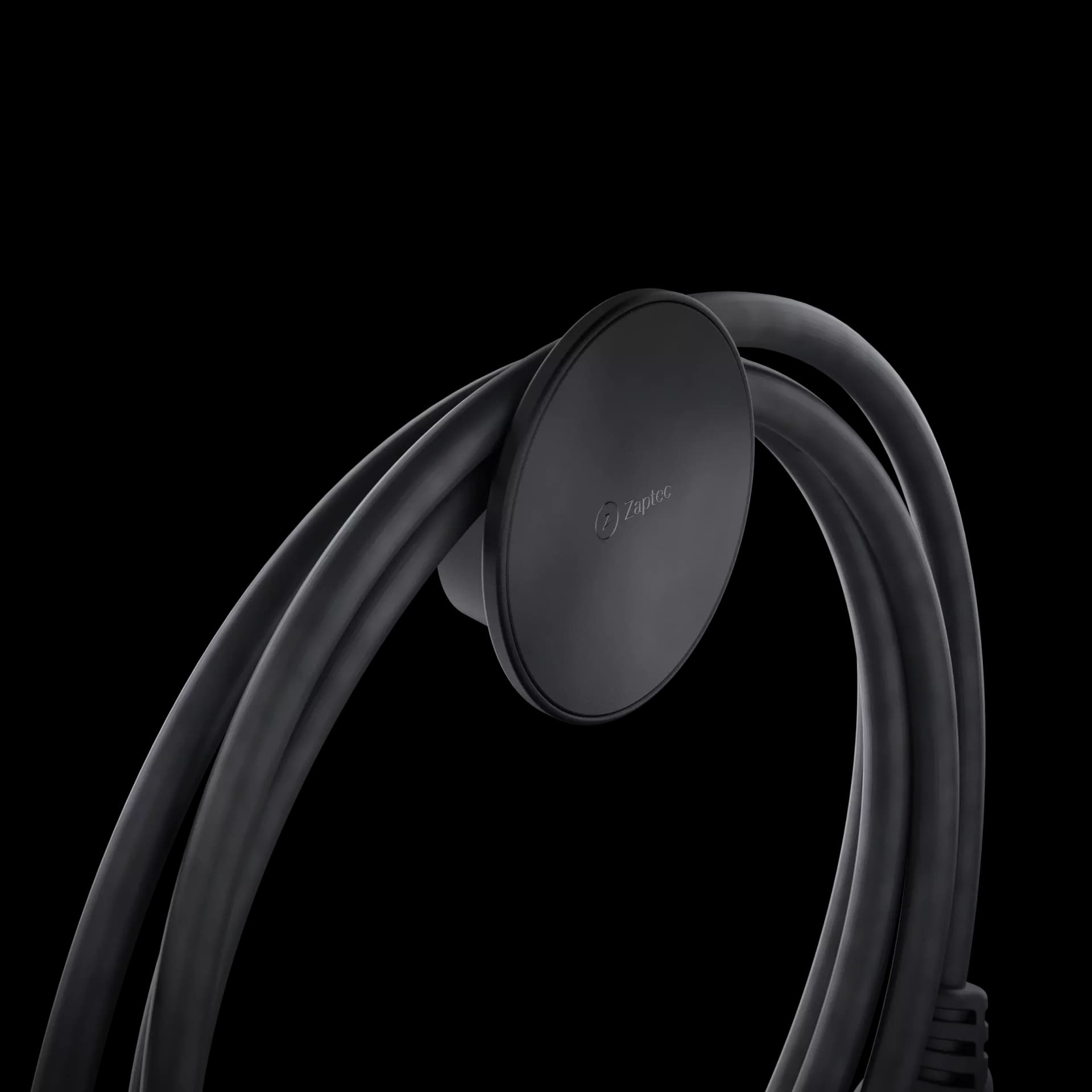 Sort rund kabelholder som holder en surret ladekabel