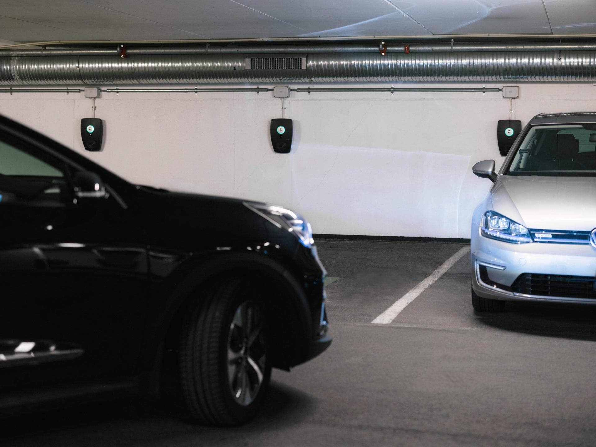 A single round cable EV charging installation in an underground car park.